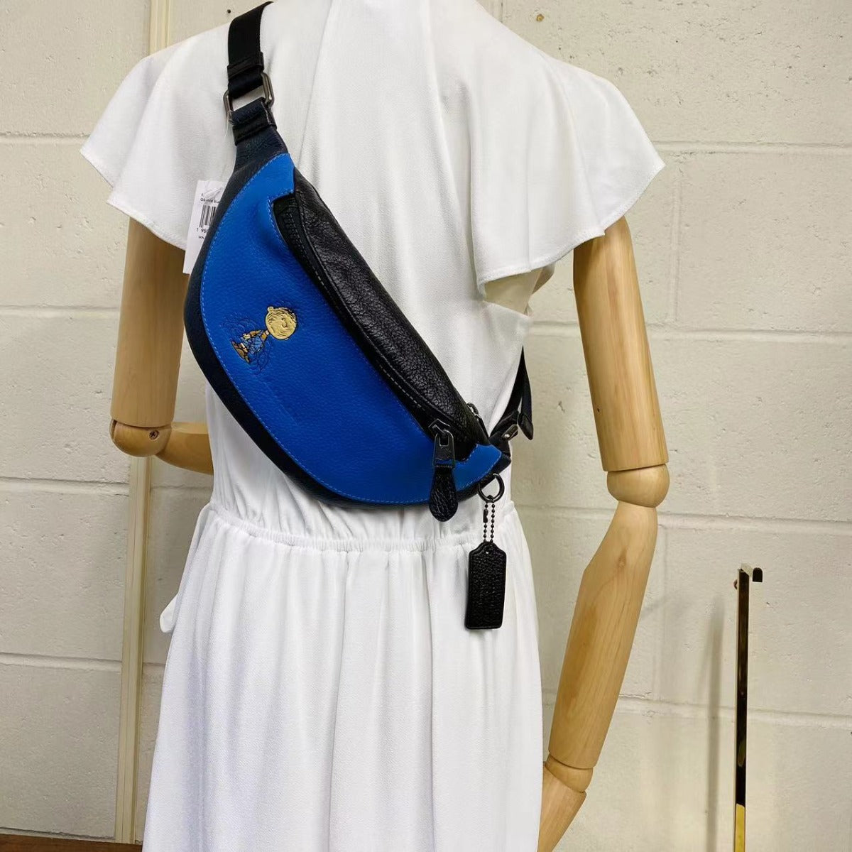 Coach 5512 X Peanuts Mini Warren Belt Bag With Pig Pen In Vivid Blue Coach 5512 X Peanuts Mini Warren Belt Bag With Pig Pen In Vivid Blue